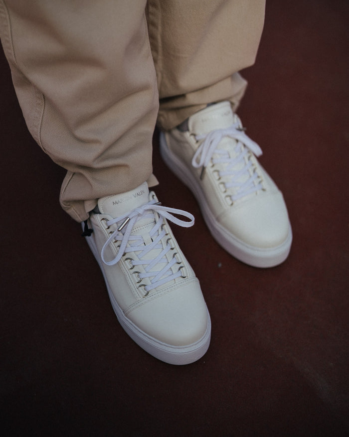 Martin Valen Trine men's white sneaker suspended, rear-side view showing heel and decorative stitching