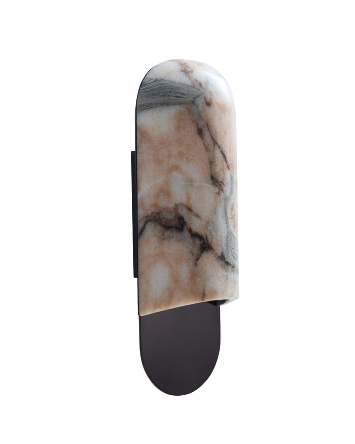 Side view of a marble wall sconce with a rounded vertical silhouette, showcasing natural beige, gray, and charcoal veining, mounted on a slim gunblack metal backplate with a softly illuminated stone surface.