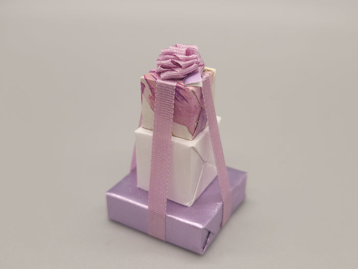 3 Tier Presents Wrapped in Purple and White Paper with Purple Bow – By Cheryl Warder
