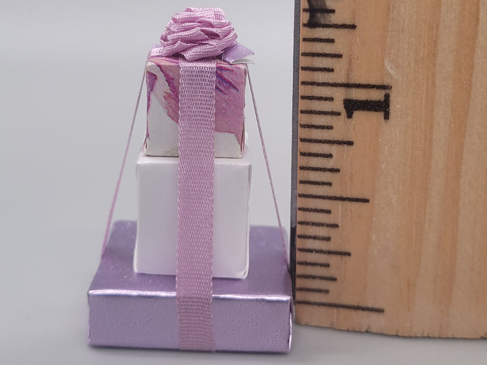 3 Tier Presents Wrapped in Purple and White Paper with Purple Bow – By Cheryl Warder