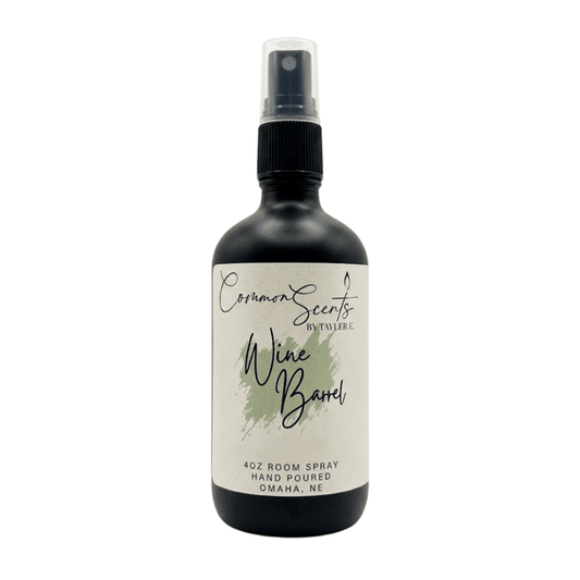 4oz Luxury Room Spray | CommonScents by Tayler E featuring a sleek black bottle with a spray nozzle and a minimalist label for a sophisticated wine barrel scent.