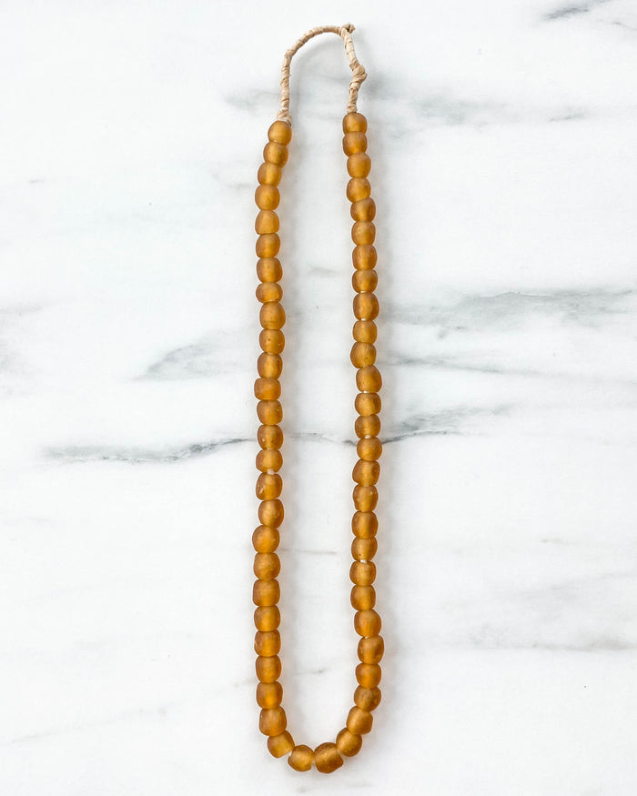 small handmade Ghanian amber glass beads