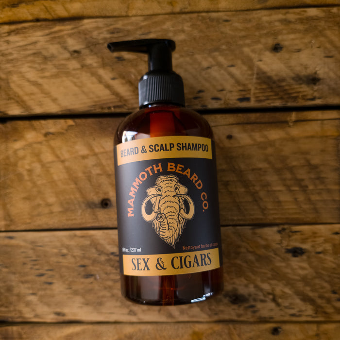 Bottle of Mammoth Beard Co. beard and scalp shampoo on a wooden background