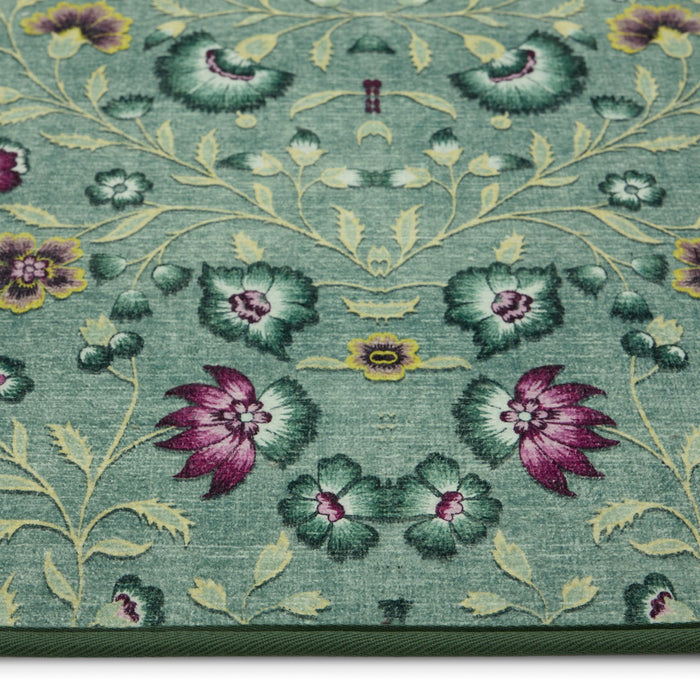 Blossoming Vines Eco-Washable Rug- a green eco-washable rug featuring colourful florals and green leaves.