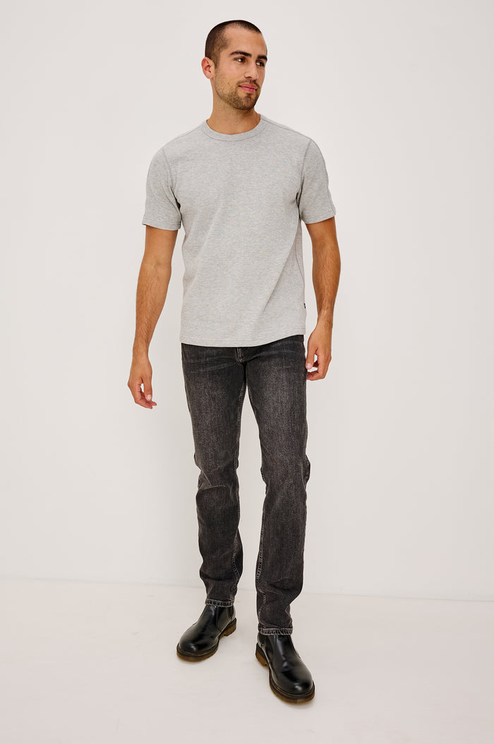 Brooks Short Sleeve T-Shirt With Crew Neckline, Short Sleeves, and Classic Fit in Washed Black Colorway - Full Body Front View Featured on Model