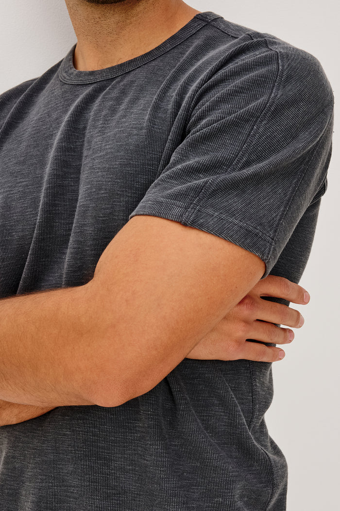 Brooks Short Sleeve T-Shirt With Crew Neckline, Short Sleeves, and Classic Fit in Washed Black Colorway - Upper Body Back View Featured on Model