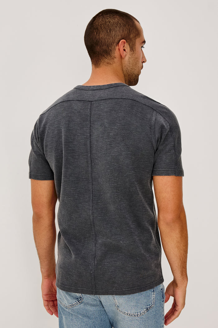 Brooks Short Sleeve T-Shirt With Crew Neckline, Short Sleeves, and Classic Fit in Washed Black Colorway - Upper Body Back View Featured on Model