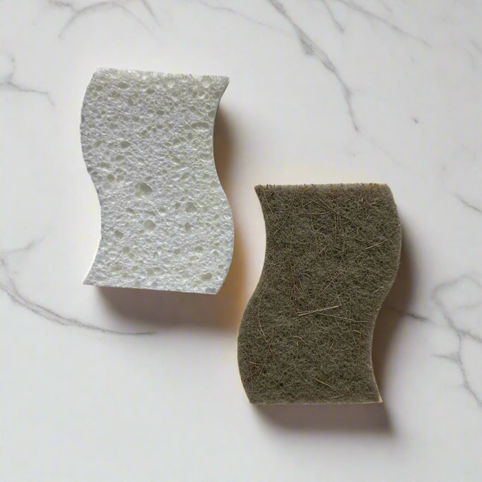 Curved cellulose sponge with sisal scrubber on white marble counter – plastic-free dish sponge in Calgary by Cuprea