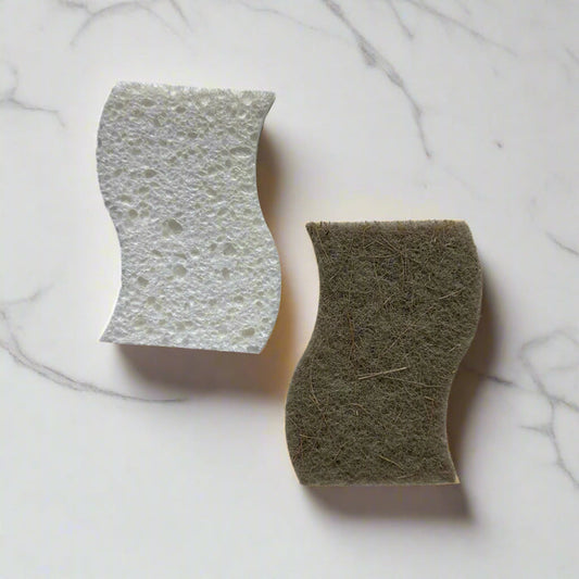 Curved cellulose sponge with sisal scrubber on white marble counter – plastic-free dish sponge in Calgary by Cuprea