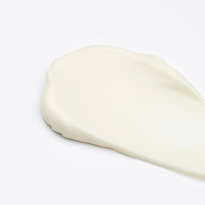 Dollop of Cyfolia Organic Radiance Cleansing Cream on white background