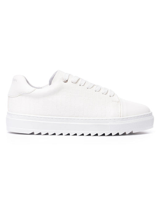 Martin Valen Dino low-top white sneaker, side view showing croc-texture upper and serrated sole