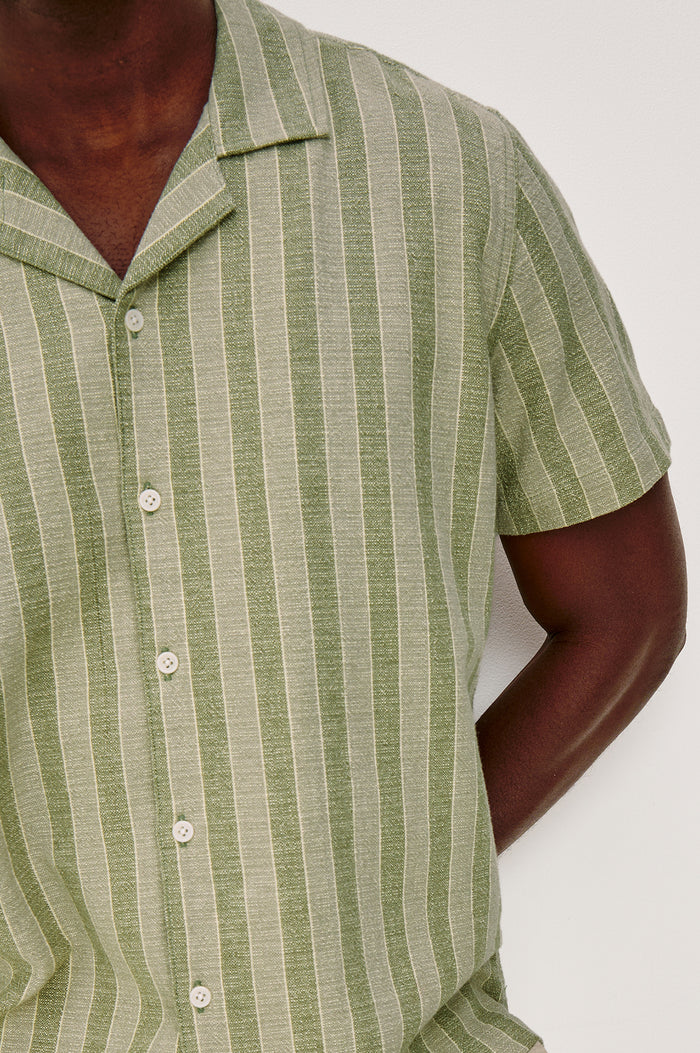 Fielder Button Front Shirt With Short Sleeves and Relaxed Boxy Fit in Sage Brush Stripe Colorway - Upper Body Front Close Up View Featured on Model