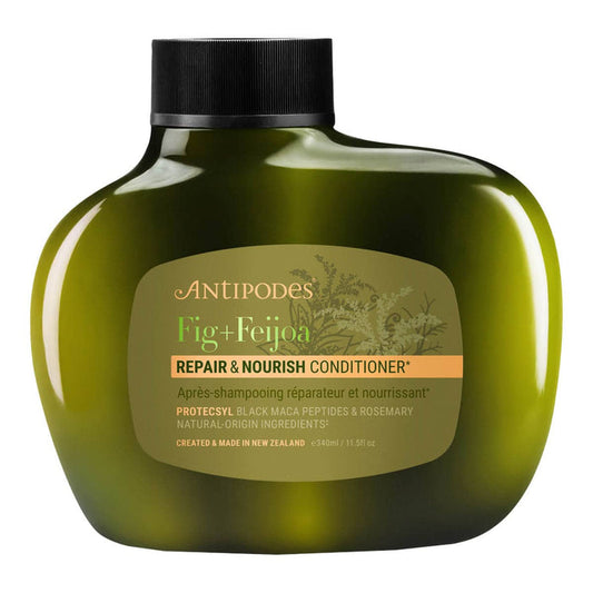 Green conditioner bottle with label on a white background.