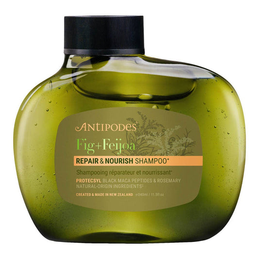 Green shampoo bottle with black cap labeled 'Antipodes Fig + Feijoa Repair & Nourish Shampoo' on a white background.