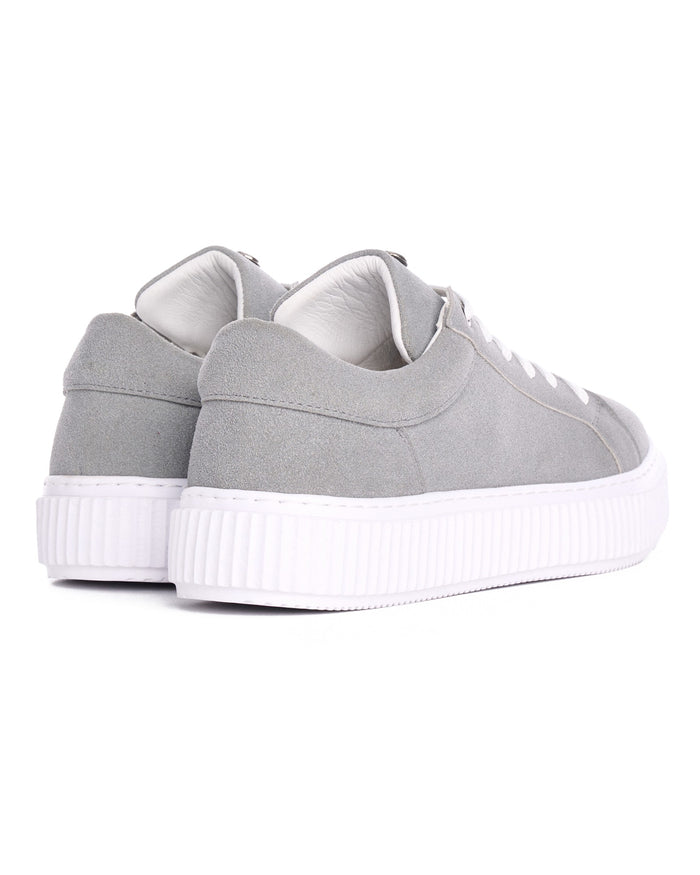 Martin Valen rear close-up of gray genuine leather sneakers, padded heel collar and white platform sole visible