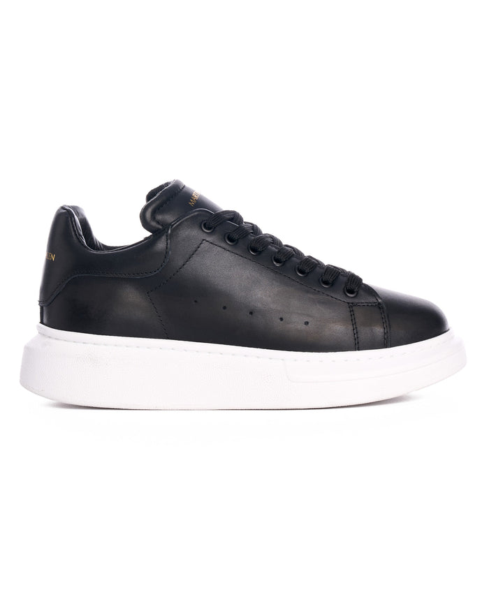 Martin Valen Hype Sole — side profile of a black sneaker on a white platform sole, close-up of laces