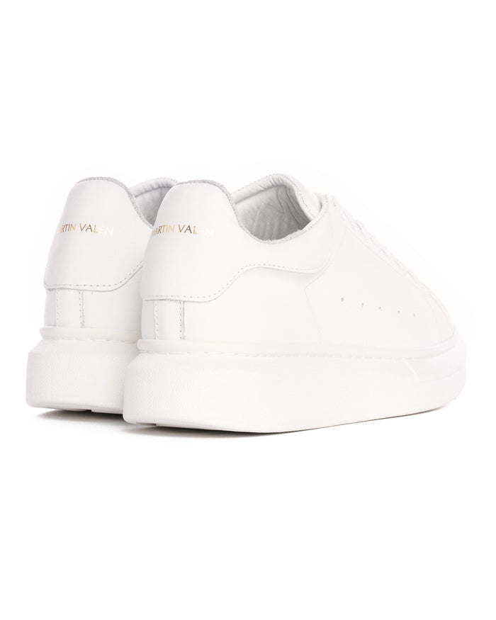 Martin Valen Hype Sole rear close-up of white sneakers showing gold logo on heel and chunky platform sole