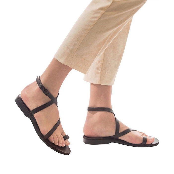 Model wearing Mara brown, handmade leather sandals with back strap and toe loop