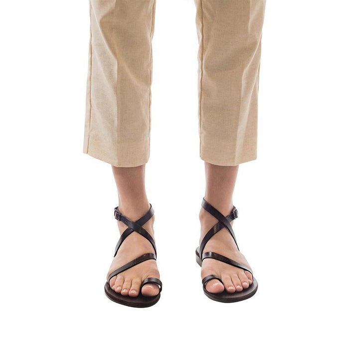 Model wearing Mara brown, handmade leather sandals with back strap and toe loop