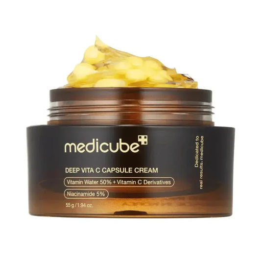 Medicube Deep Vita C Capsule Cream jar with cream on top on a white background