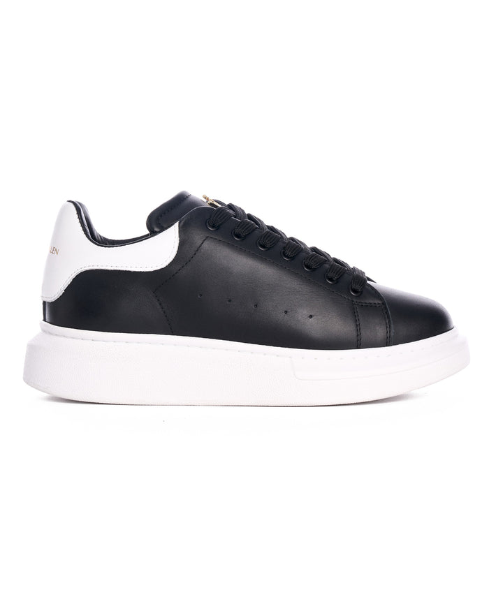 Martin Valen Crowned Hype Sole men's black leather sneaker, side view with white heel tab and thick white sole