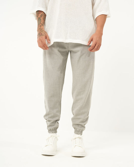 Martin Valen men's gray jogger, front mid-body view showing loose fit and elastic cuffs