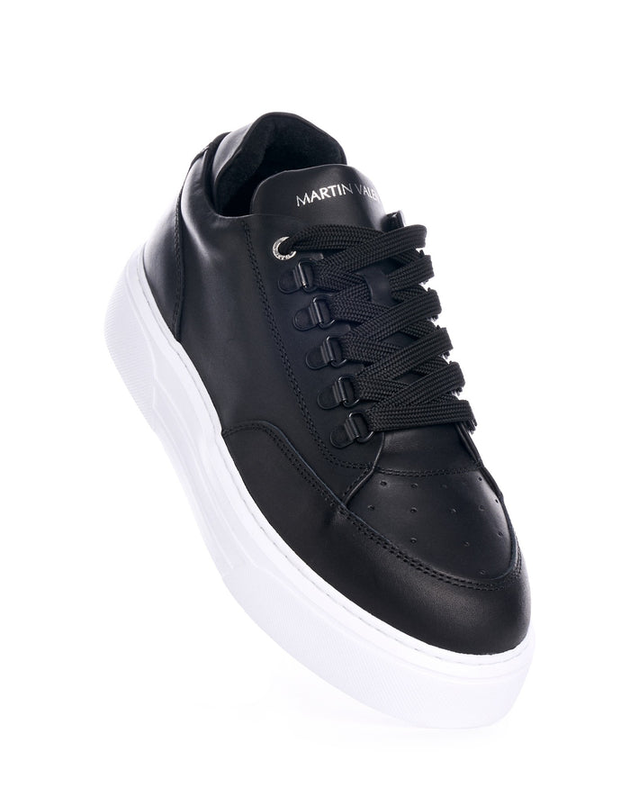 Martin Valen black low-top leather sneakers, top-front view showing thick laces and white chunky sole