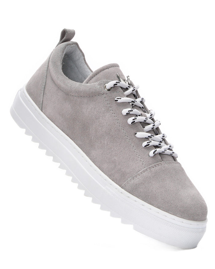 Martin Valen men's low-top grey leather sneakers, close side-top view showing patterned white laces and ridged white platform sole
