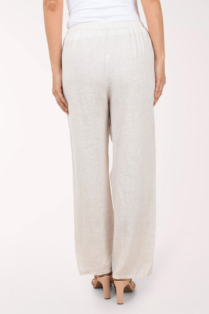 Beige wide-leg pants worn by a person on a white background