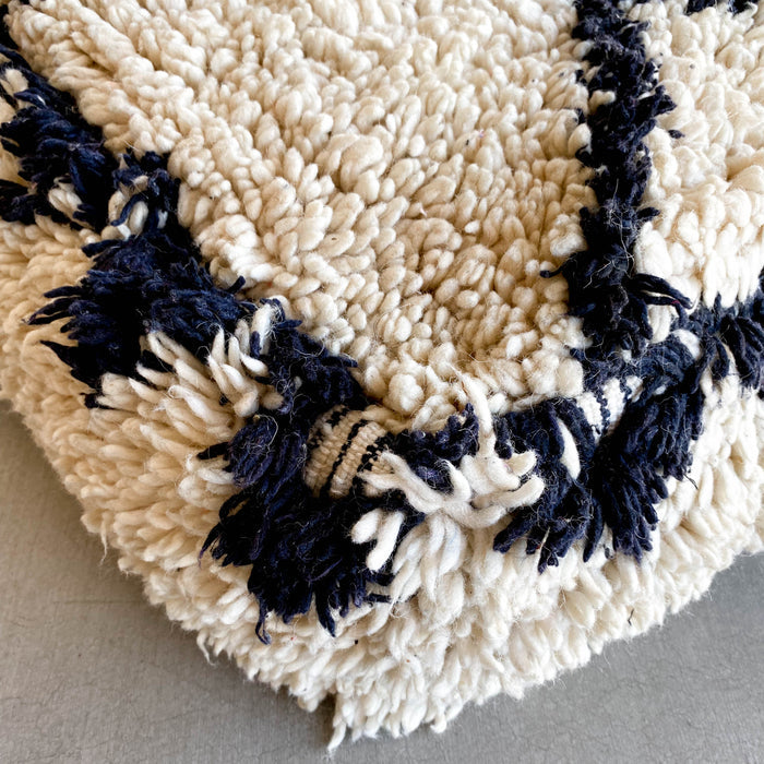 Moroccan pouf IV made using vintage a beni ourain rug