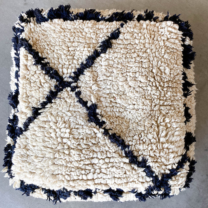 Moroccan pouf IV made using vintage a beni ourain rug