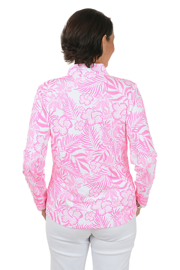Woman wearing a pink floral patterned shirt with a white background. Back shot.