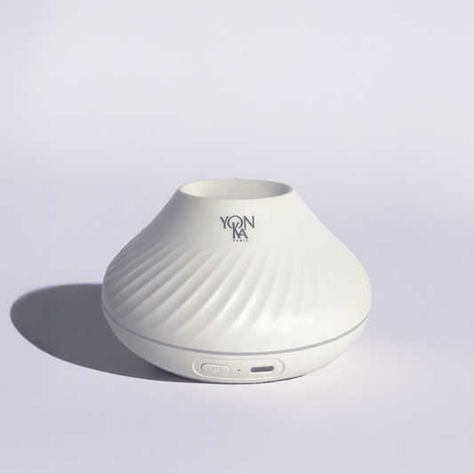 Sleek white sculpted diffuser with subtle spiral texture and Yon-Ka Paris logo, designed for wellness and skincare ambiance, named Quintessence Diffuser | YON-KA PARIS.