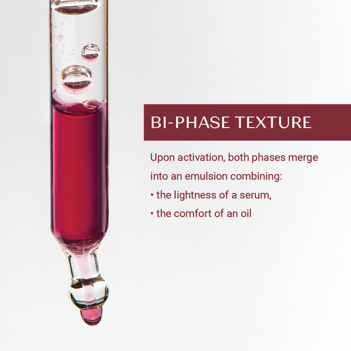 Close-up of a dropper containing a dual-phase liquid illustrating the bi-phase texture of Retinol-Like Bi-Serum | Yon-Ka Paris, highlighting its light serum and comforting oil blend.
