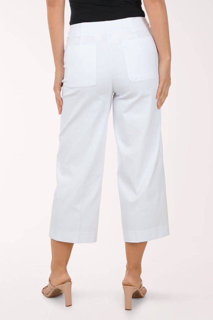 White wide-leg pants worn by a person on a white background