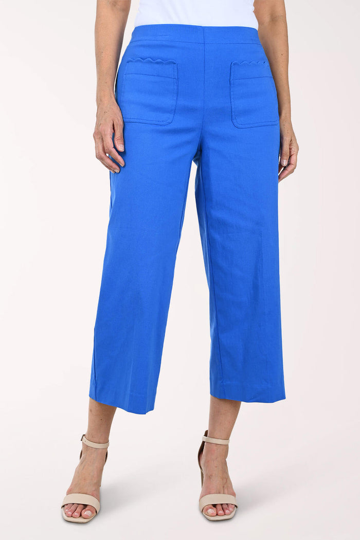 Blue pants worn by a person on a white background