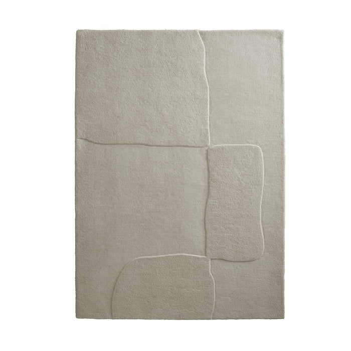Sculptured Wool Boulder Rug- a 100% wool cut pile rug in Cream with a patterned design.