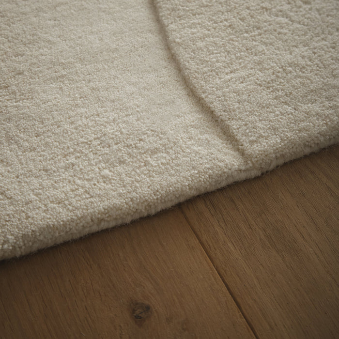 Sculptured Wool Boulder Rug- a 100% wool cut pile rug in Cream with a patterned design.