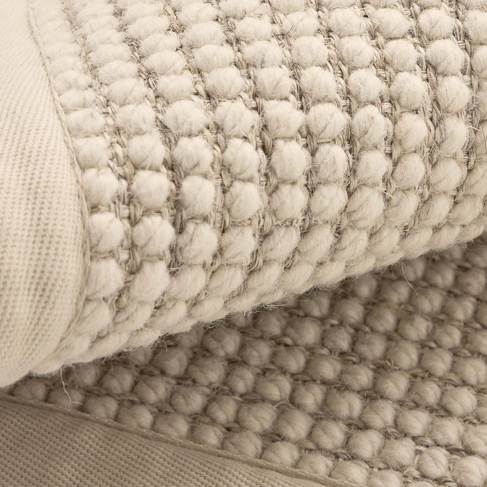 Sisal Boucle Beige Rug made from 100% wool with a beige border.