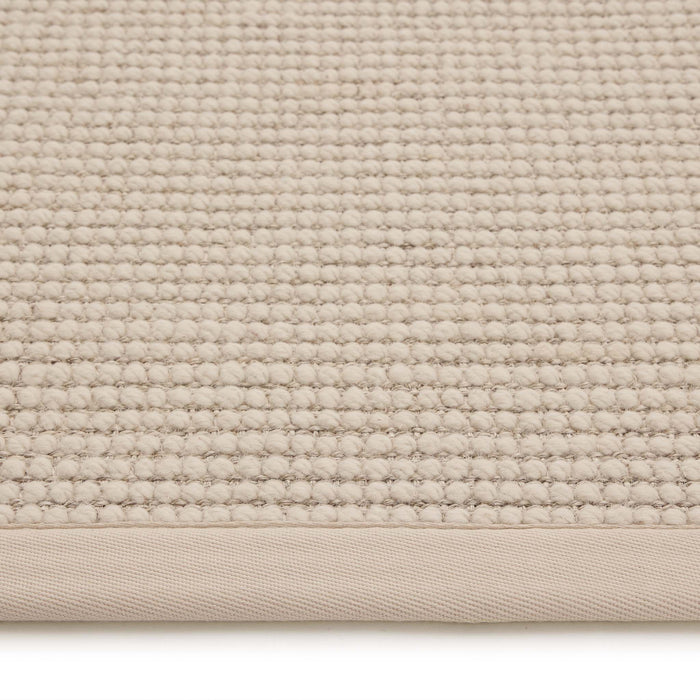 Sisal Boucle Beige Rug made from 100% wool with a beige border.