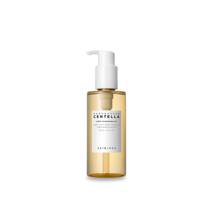 A bottle of Madagascar Centella Light Cleansing Oil with a pump dispenser, labeled in a minimalist style with white and gold colors.