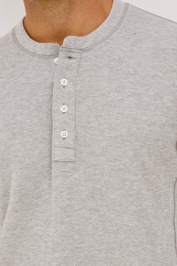 Soto Henley in Rib Cotton With Half Button Placket, Long Sleeves, and Crew Neckline in Grey Heather Colorway - Upper Body Front View Featured on Model