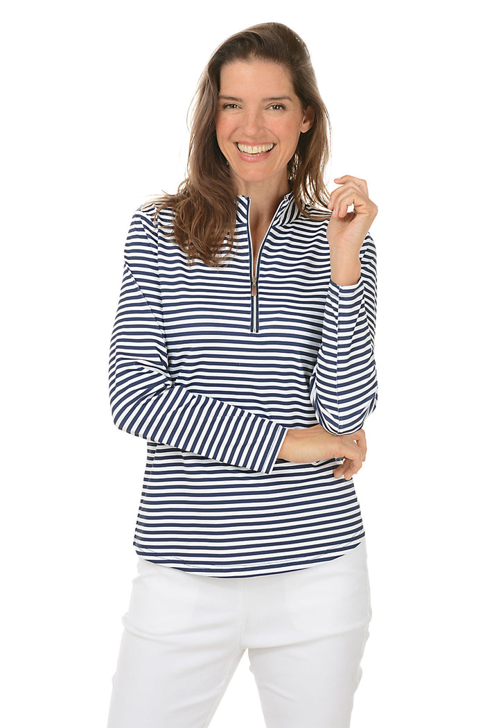 Woman wearing a navy and white striped shirt with a white background. Second front shot.