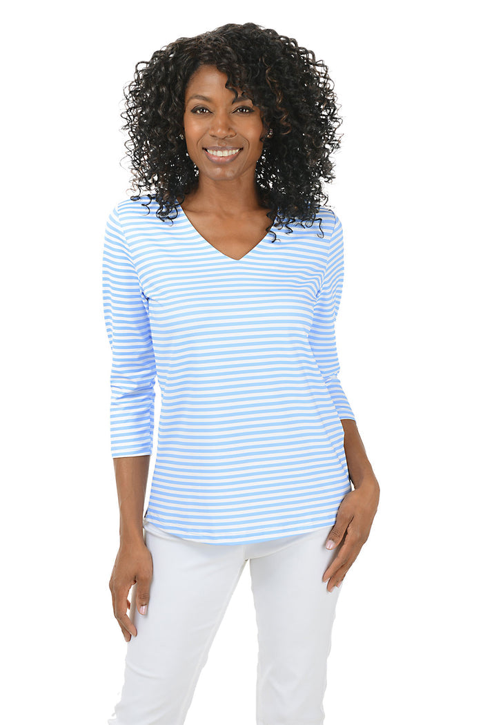 Woman wearing a blue and white striped shirt on a white background.