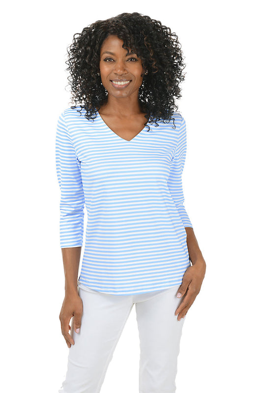 Woman wearing a blue and white striped shirt on a white background.