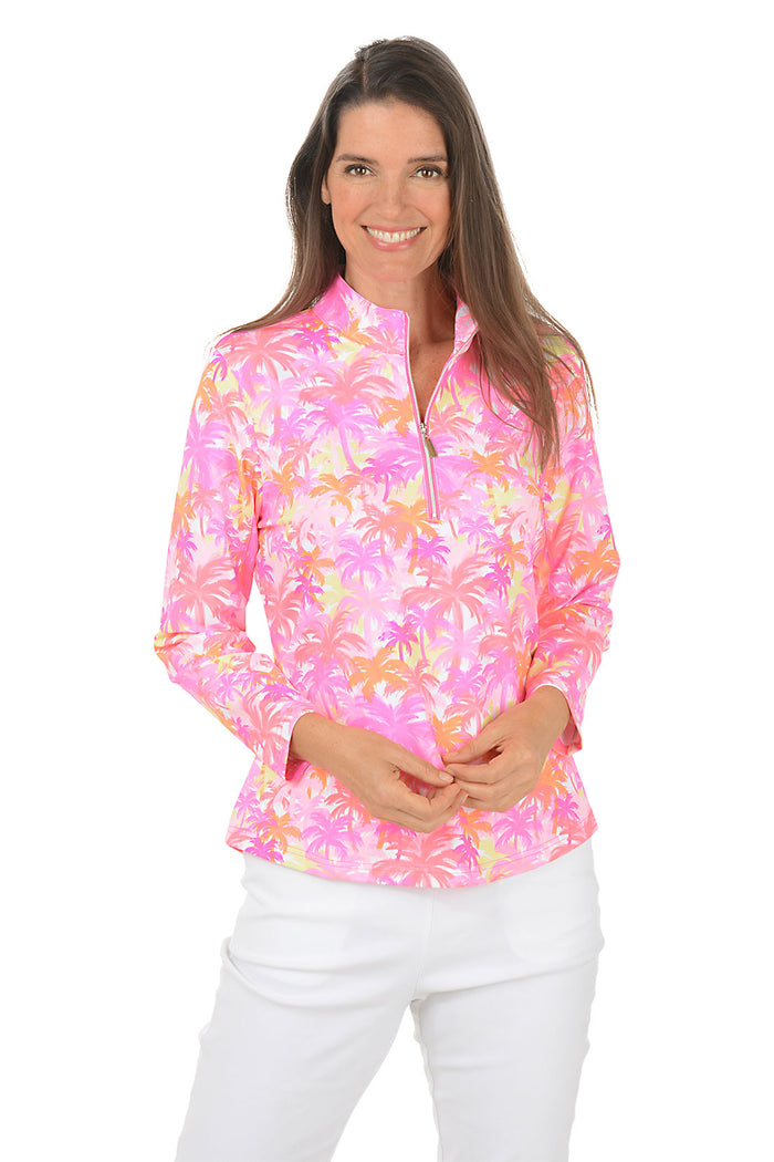 Woman wearing a colorful floral long-sleeve shirt on a white background. Second front shot.