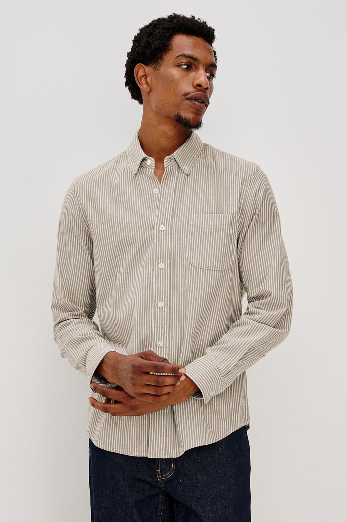Vance button front collared shirt with long sleeves, collard stand buttons and a single chest pocket in Cedar Oat Stripe colorway. Front view shown on model.