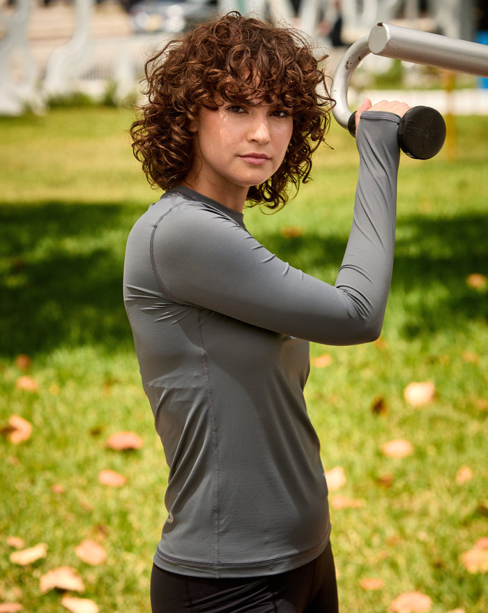 Women workign out wearing smoke long sleeve 24/7 shirt with black tights. (Style 2001) - BloqUV